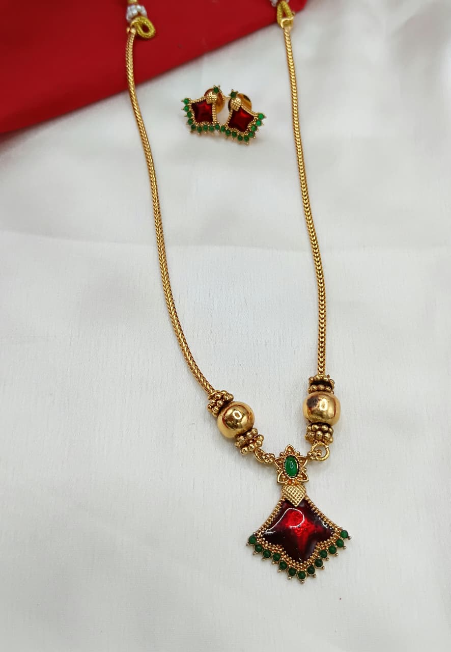 Geometric Ruby Kemp Pendant Necklace with Textured Gold Accents